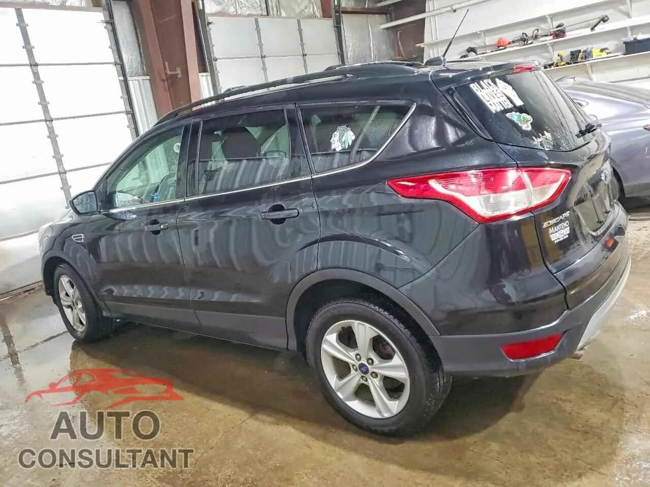 2014 FORD ESCAPE Damaged VIN 1FMCU0GX1EUC39170 – rear exterior 2014 FORD ESCAPE Damaged VIN 1FMCU0GX1EUC39170 – rear exterior