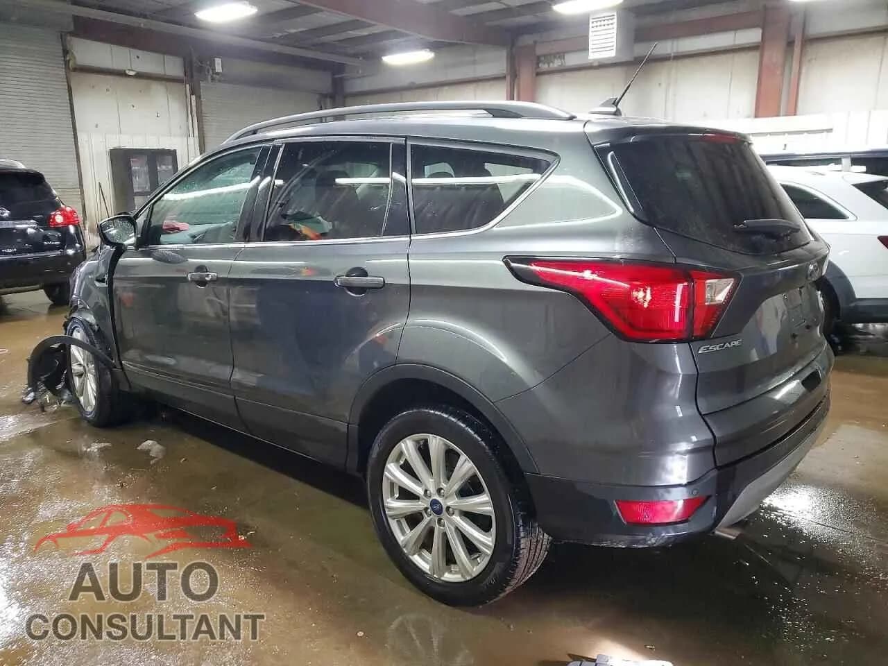 2019 FORD ESCAPE Damaged VIN 1FMCU9HD0KUB22149 – rear exterior 2019 FORD ESCAPE Damaged VIN 1FMCU9HD0KUB22149 – rear exterior