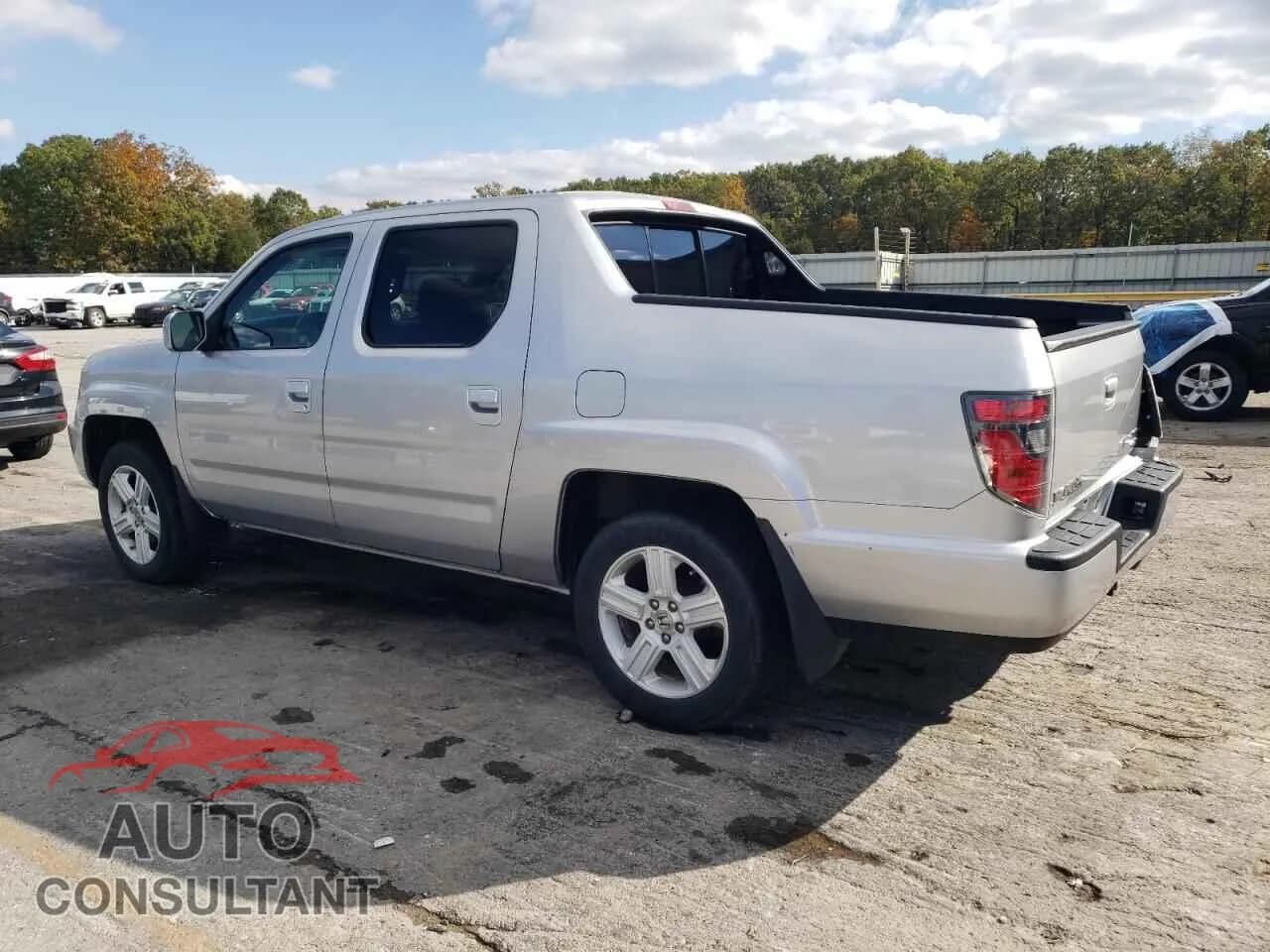 2012 HONDA RIDGELINE Damaged VIN 5FPYK1F52CB002626 – rear exterior 2012 HONDA RIDGELINE Damaged VIN 5FPYK1F52CB002626 – rear exterior