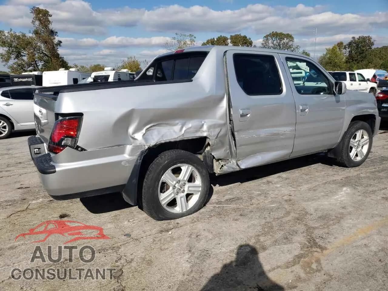 2012 HONDA RIDGELINE Damaged VIN 5FPYK1F52CB002626 – side profile 2012 HONDA RIDGELINE Damaged VIN 5FPYK1F52CB002626 – side profile