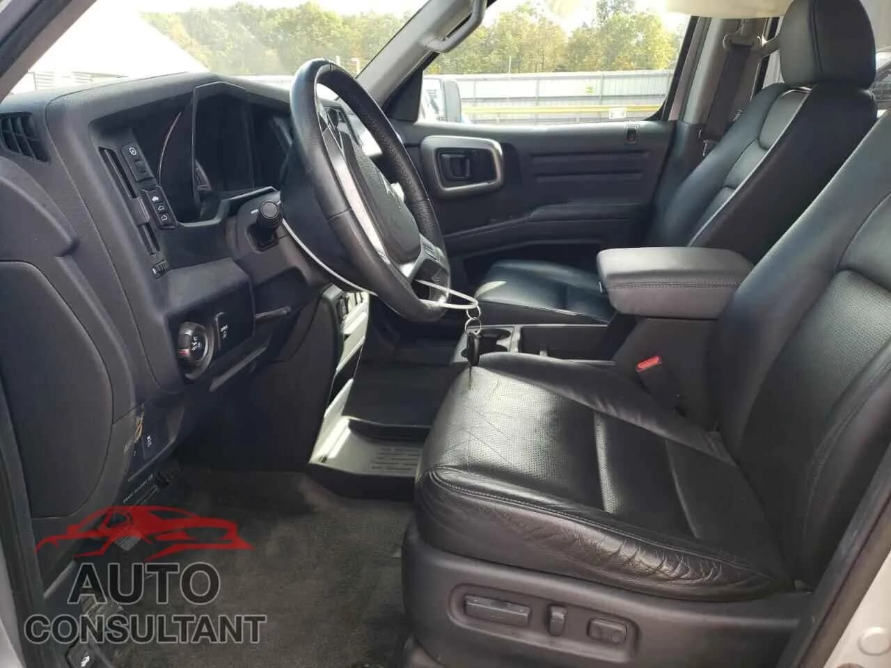 2012 HONDA RIDGELINE Damaged VIN 5FPYK1F52CB002626 – exterior detail 2012 HONDA RIDGELINE Damaged VIN 5FPYK1F52CB002626 – exterior detail