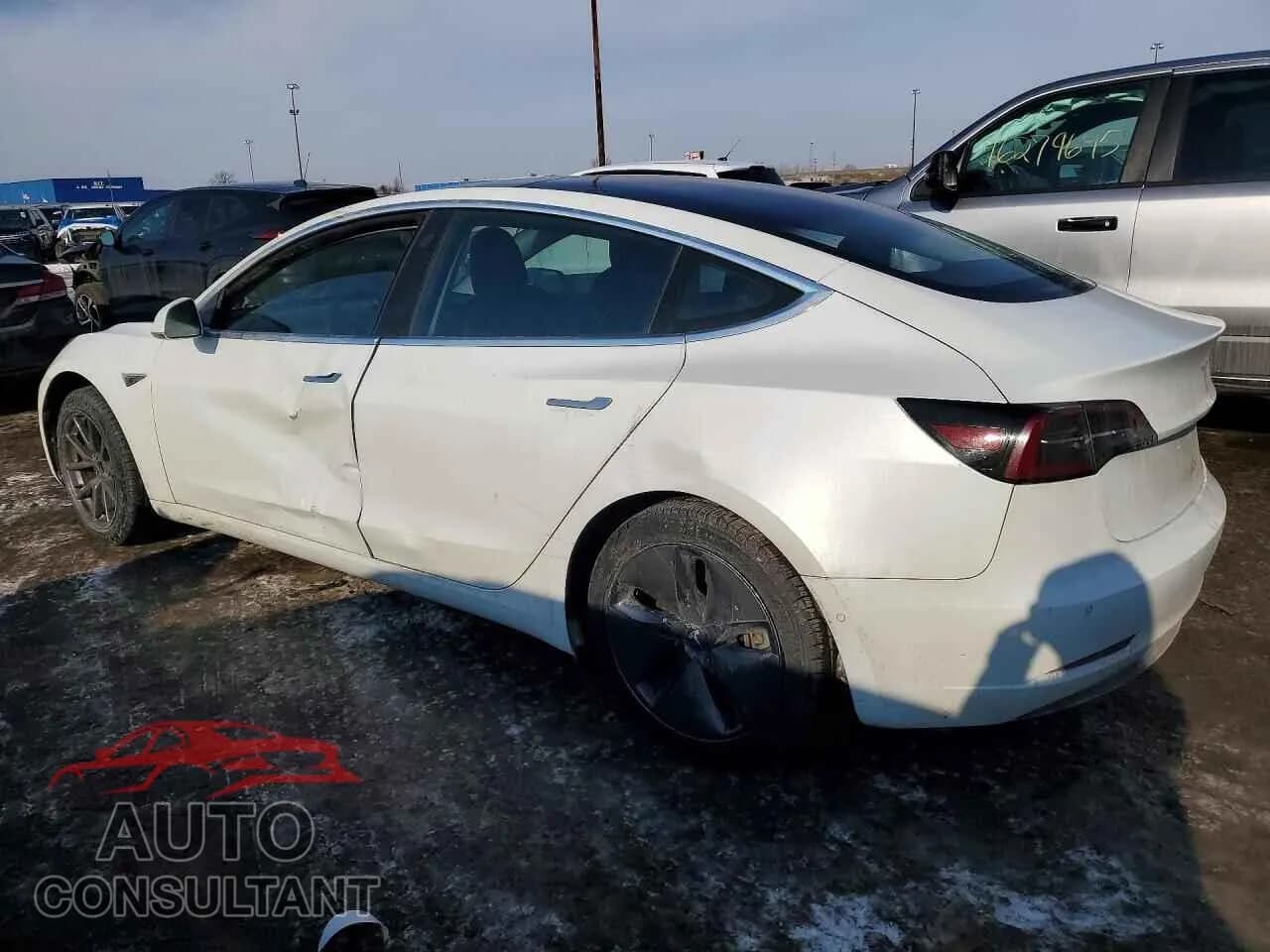 2018 TESLA MODEL 3 Used VIN 5YJ3E1EA3JF052182 – rear exterior 2018 TESLA MODEL 3 Used VIN 5YJ3E1EA3JF052182 – rear exterior