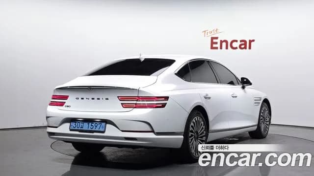 2022 Genesis Electrified G80 (RG3) e-AWD Sold VIN KMTGE411PNU000922 – front exterior 2022 Genesis Electrified G80 (RG3) e-AWD Sold VIN KMTGE411PNU000922 – front exterior