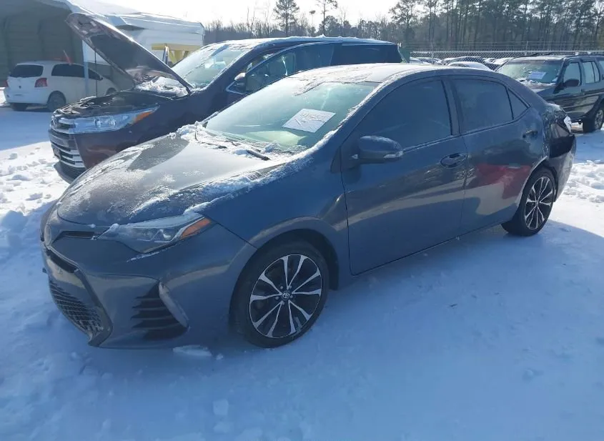 2018 TOYOTA Corolla Used VIN 5YFBURHE2JP790569 – side profile