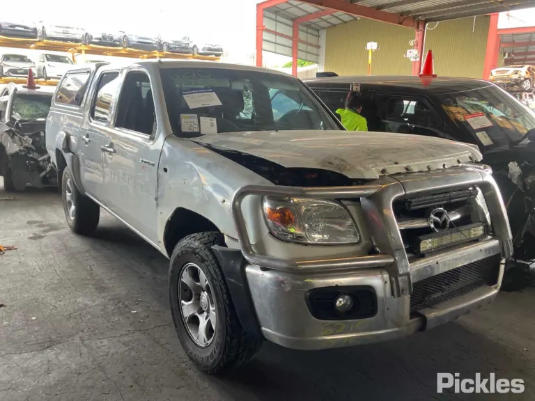 2011 Mazda BT-50 Damaged VIN MM0UNY0E400899909 – side profile
